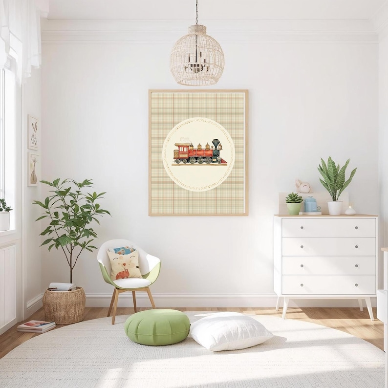 May include: A framed print featuring a vintage train illustration in red, orange, and black, set against a beige plaid background. The artwork is displayed in a bright, airy room with a white dresser, a green chair, and a round rug.