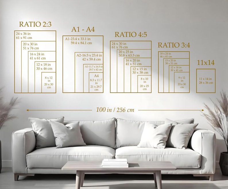 May include: A wall display featuring various rectangular frames with dimensions in inches and centimeters, labeled with ratios like 2:3, 4:5, and 3:4. The text includes measurements such as 24 x 36 in (61 x 91 cm). A sofa and table are in the foreground.