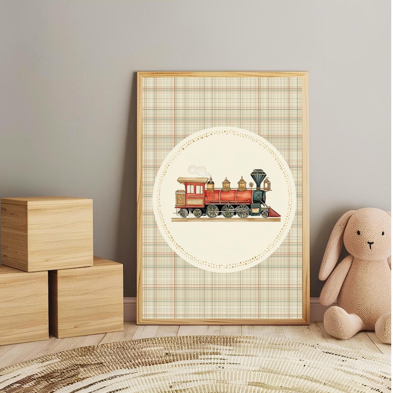 May include: A framed print featuring a vintage steam train illustration. The train is red, black, and gold, set against a cream-colored circle with a dotted border. The background is a plaid pattern in beige, brown, and red.