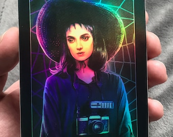 BEETLEJUICE "Lydia The Shutterbug" Holographic foil sticker 4.1" x 5.4" Tim Burton Nathan Anderson Winona Ryder
