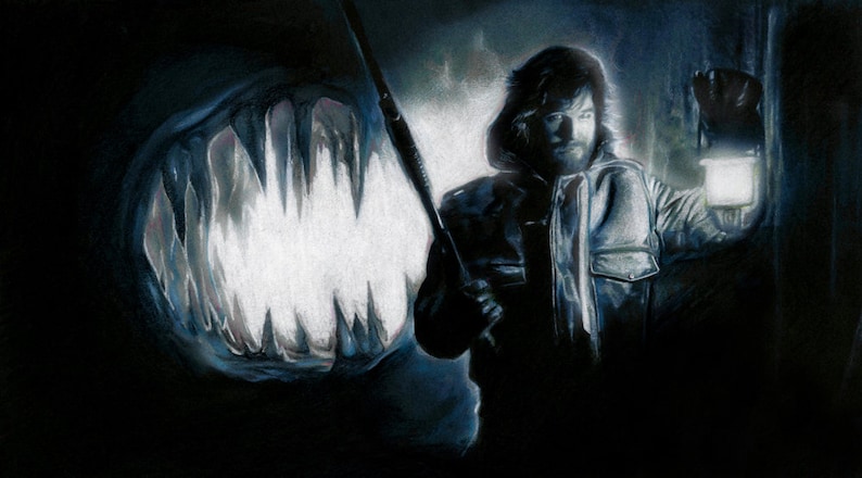 May include: A man in a dark jacket and a hooded sweatshirt holds a flashlight and a fishing rod. He is standing in front of a large, dark, open mouth with sharp teeth.