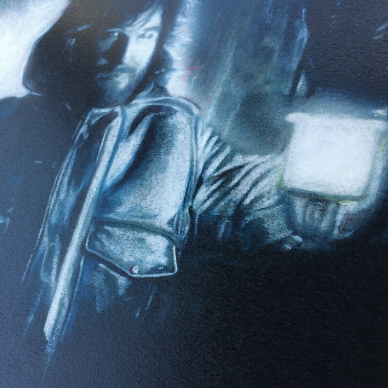 May include: A close-up of a person's face, partially obscured by a shadow, with a white and blue striped shirt. The person is wearing a hat and is looking to the right.