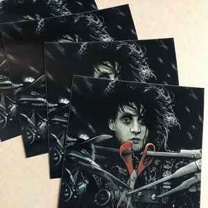 May include: A black and white illustration of a man with long, dark hair holding a pair of red scissors. The man is surrounded by a variety of scissors, all of which are black and white.