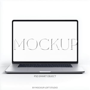 May include: A silver laptop with a black keyboard and a white screen displaying the word MOCKUP in a serif font. Below the laptop, the text reads PSD SMART OBJECT and BY MOCKUP LOFT STUDIO. The device features a thin bezel and a metallic finish.
