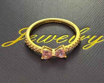 Modieuze damesring met vergulde roze strik