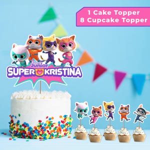 May include: A white cake with colorful sprinkles, topped with a "Super Kristina" cake topper featuring cartoon cat characters. Includes 8 cupcake toppers with matching cat designs. Text on the image reads "1 Cake Topper 8 Cupcake Topper".