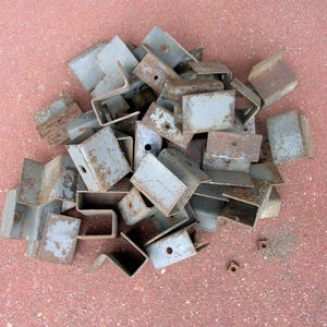 36 rusty metal brackets: salvaged hardware, artist supply, metal assemblage