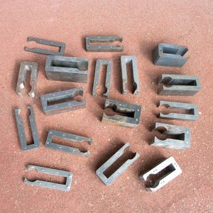 May include: A white ceramic mug with a black handle and the text "But First, Coffee" in a bold, black font. The mug is set against a neutral background, highlighting its simple design.