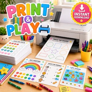 May include: A white printer sits on a desk with educational activity sheets featuring shapes, counting, and matching games. Colorful crayons, a stack of worksheets, and a yellow cup are arranged nearby. The text reads Print & Play and Instant Download.