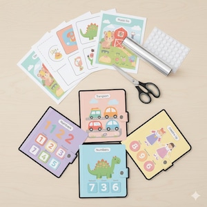 May include: A collection of children's educational materials, including colorful number and activity books, flashcards with animal illustrations, and a pair of scissors. The books feature numbers and images of cars, dinosaurs, and children.