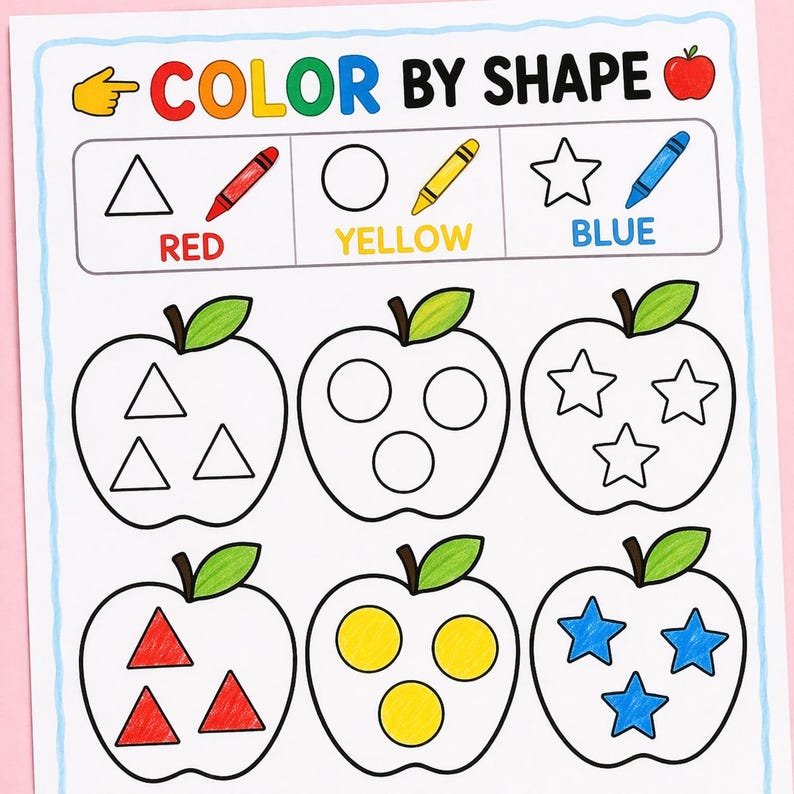 May include: A Color by Shape educational worksheet featuring a header with the text COLOR BY SHAPE and a key showing a red triangle, yellow circle, and blue star. Below are six apple outlines, with the bottom row filled in with red, yellow, and blue.