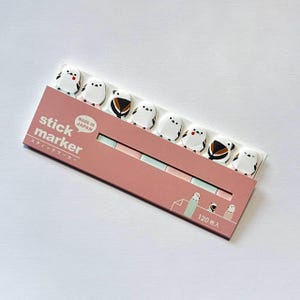 May include: A pack of stick markers featuring bird designs. The markers are white with black and brown details, and the packaging is pink with Japanese text. The pack contains 120 markers.