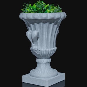 May include: A grey, ornate urn-shaped planter with a square base, filled with green leafy plants. The planter has a fluted design and decorative handles. The background is black.