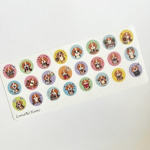 May include: A sheet of round stickers featuring cartoon beagle dogs in various poses and settings. The stickers are on a white background and have a variety of colorful backgrounds, including pink, blue, and yellow. The text "LunaNoYume" is printed on the bottom left.
