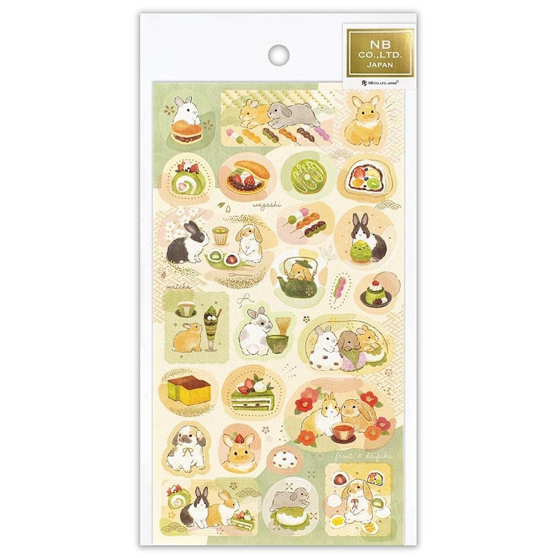 May include: A sheet of decorative stickers featuring illustrations of rabbits and Japanese sweets. The stickers are in various shapes and sizes, with a color palette of green, white, and brown. The text "NB CO., LTD. JAPAN" is printed on the top right.