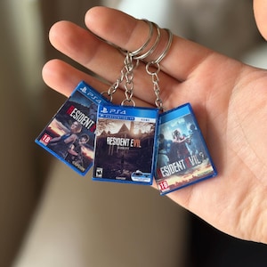 May include: A set of three ceramic mugs with a speckled, matte finish. The mugs are in shades of cream, light grey, and dark grey. Each mug has a simple, minimalist design, ideal for coffee or tea.