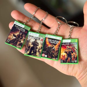 Llavero con forma de estuche de juego de Gears of War para Xbox 360 – Llavero mini de Gears of War: Judgement – Regalo para gamers