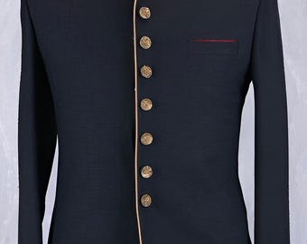 May include: A black formal jacket with a mandarin collar and gold-colored buttons. The collar and cuffs are trimmed with gold embroidery. A red accent is visible on the chest pocket.
