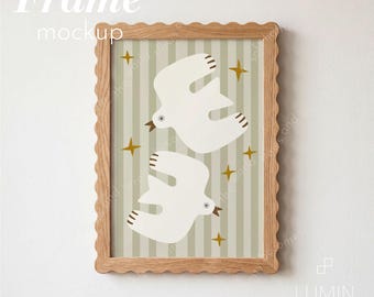 May include: A light wood scalloped frame containing a print with a vertical striped background in beige and white. The print features two white birds in flight and several small gold four-pointed stars scattered across the composition.