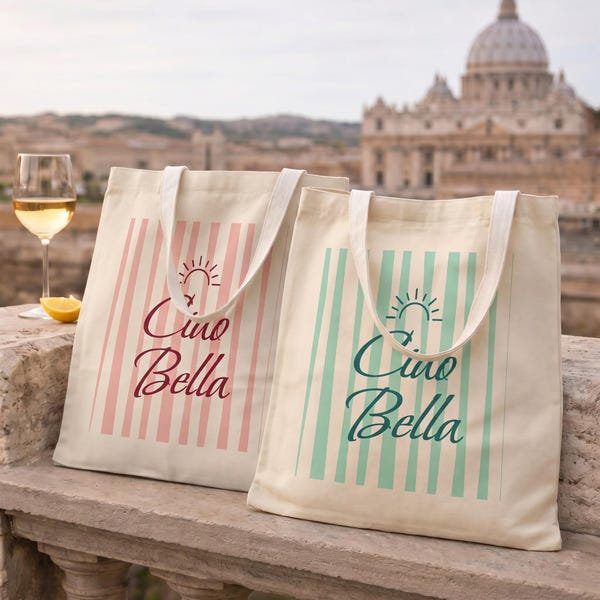 Ciao Bella striped Italian coastal tote bag in aqua and pink stripes, shown in front of a European landmark