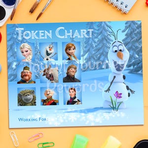 May include: A blue token chart featuring characters from the movie Frozen, including Elsa, Olaf, and Anna. The chart has the words "Token Chart" at the top and "Working For:" at the bottom. A smiling Olaf is on the right side of the chart.