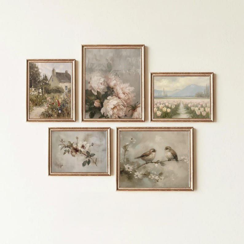 May include: A set of five framed vintage-style art prints. The prints feature floral, landscape, and bird themes in soft, muted colors. Each print is encased in a gold-toned frame, creating a cohesive gallery wall aesthetic.