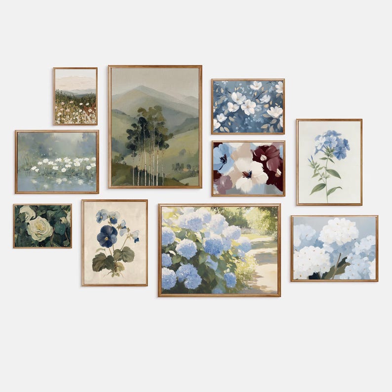 May include: A collection of framed floral and landscape art prints. The prints feature various flowers, including hydrangeas and white blooms, and scenic views of mountains and fields. The frames are a warm, natural wood tone.