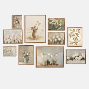 May include: A collection of framed art prints with a vintage aesthetic. The artwork features floral and animal themes, including a mouse holding flowers, birds, and various flower arrangements. The color palette is soft, with muted tones of beige, green, and pink.