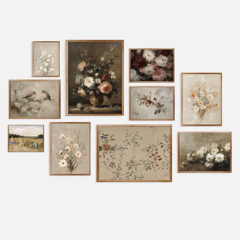 May include: A collection of framed floral art prints in various sizes. The prints feature vintage-style botanical illustrations with soft color palettes of beige, cream, and muted pinks. The frames are a warm, natural wood tone, creating a cohesive gallery wall.