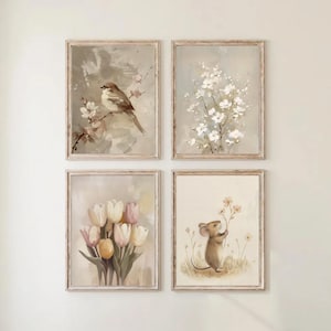 May include: Set of four framed art prints featuring watercolor illustrations. The prints depict a bird on a branch, white flowers, tulips, and a mouse holding flowers. Each print has a light brown wooden frame.