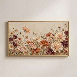 May include: A rectangular wall art piece in a thin gold frame featuring a textured painting of a field of cosmos flowers in shades of cream, soft pink, deep burgundy, and burnt orange against a neutral, light beige background.