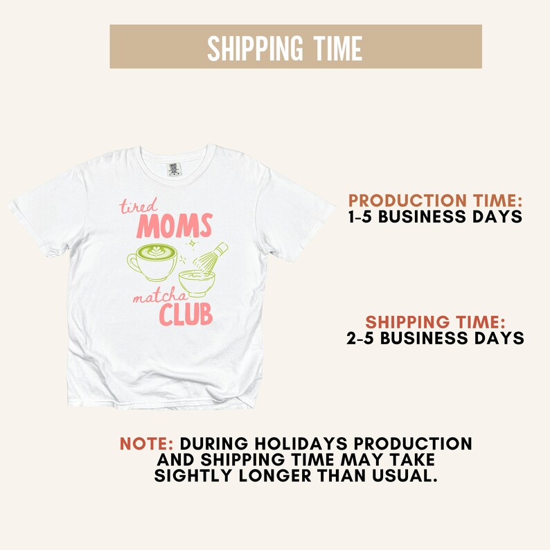 May include: White crew neck t-shirt featuring the text "tired MOMS matcha CLUB" in pink and green. The design includes a matcha latte and whisk. A casual top.