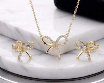 Set sierlijke strikketting en stekeroorbellen | 18k vergulde kristallen lintsieraden
