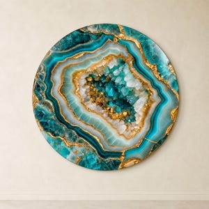 May include: A circular wall art piece featuring a geode-inspired design with concentric layers of teal, turquoise, and white. The centre contains crystalline structures and gold-coloured accents, creating a textured, multi-layered appearance.