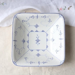 May include: A set of three ceramic mugs with a speckled, matte finish in cream, light grey, and dark grey. Each mug has a simple, minimalist design and a rounded handle.