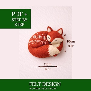 May include: A handcrafted felt fox in a curled sleeping position. The fox is primarily orange with white accents on the chest and tail. It measures 4.3 inches long and 3.9 inches high. The design includes snowflake details. Text on the image reads "PDF + STEP BY STEP" and "FELT DESIGN WONDER FELT STORY."