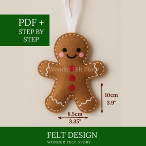 May include: A felt gingerbread man decoration with a white stitched outline, rosy cheeks, and a smiling face. It has red button accents and a white ribbon for hanging. The ornament is 10 cm tall and 8.5 cm wide. The text "PDF + STEP BY STEP" and "FELT DESIGN" are also visible.