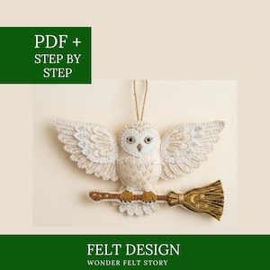 May include: A white felt owl with outstretched wings, perched on a brown broom. The owl has detailed wings and golden accents. The image includes the text "PDF + STEP BY STEP" and "FELT DESIGN WONDER FELT STORY".