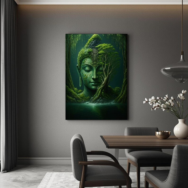 A framed print of a green Buddha head in a forest hangs on a dark gray wall in a dining room with a table and chairs.