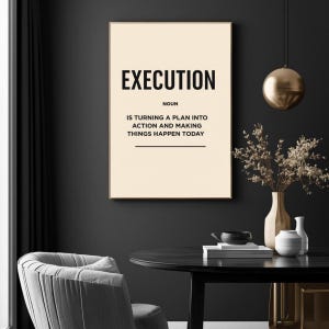 May include: A framed print with the word "EXECUTION" in bold black letters. Below, the definition reads: "NOUN IS TURNING A PLAN INTO ACTION AND MAKING THINGS HAPPEN TODAY." The print is displayed in a room with a dark wall and decorative elements.