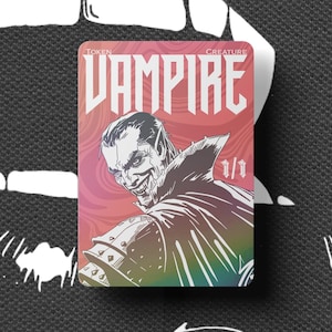May include: A Vampire token card featuring a smiling vampire illustration. The card has the text "VAMPIRE" and "1/1". The background has a red and black design with an open mouth.