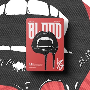 May include: A red card with the word "BLOOD" in white, featuring a black illustration of vampire lips with dripping blood. The card is labeled "TOKEN" and "ARTIFACT". The background is a black and red design.