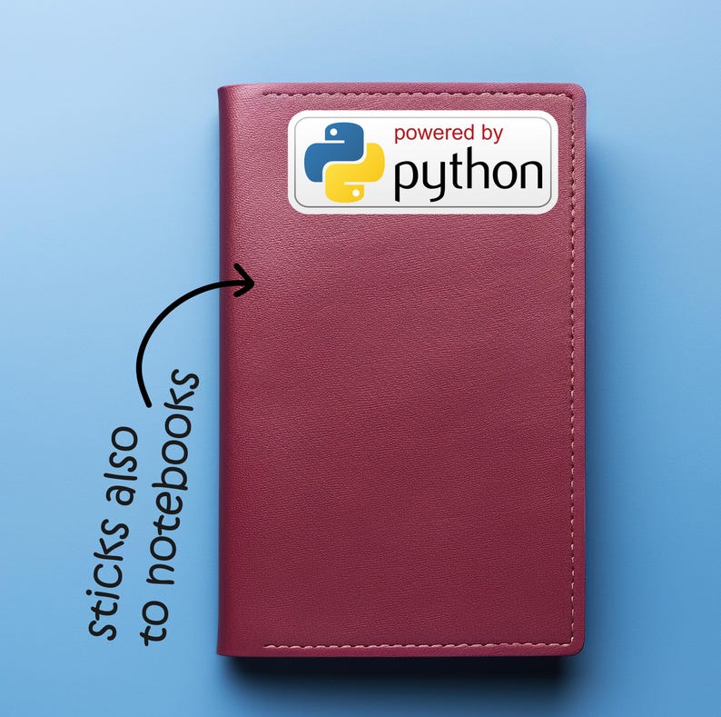 May include: A burgundy notebook with a white sticker that says "powered by python" with the Python logo. The notebook is on a blue background. Text on the image says "sticks also to notebooks".