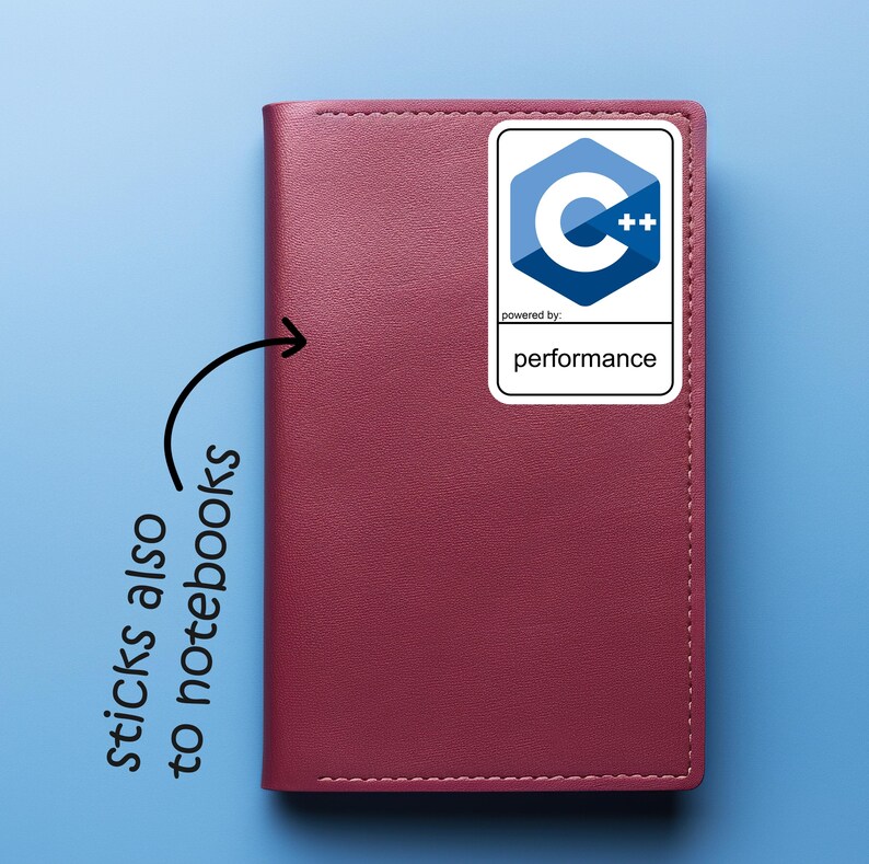 May include: A burgundy notebook with a white sticker featuring a blue and white C++ logo and the word "performance". The sticker is on the upper right corner of the notebook. The text "sticks also to notebooks" is written on the left side of the notebook.