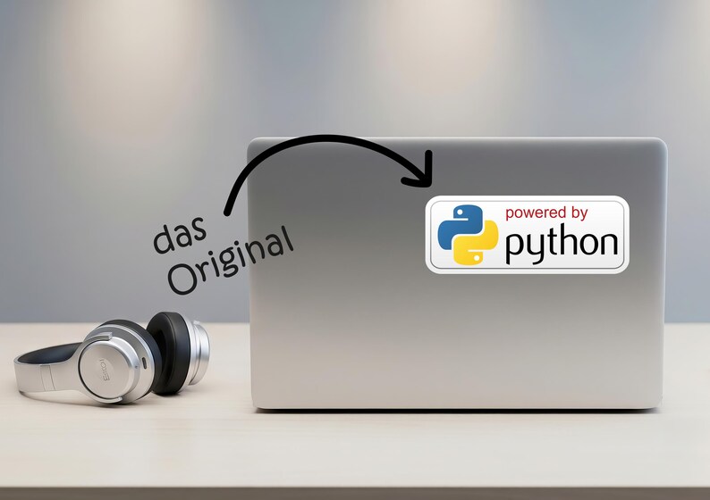 May include: A silver laptop with a sticker that says "powered by python" in white text. The sticker features a blue and yellow logo. A pair of silver and black headphones are on the table.
