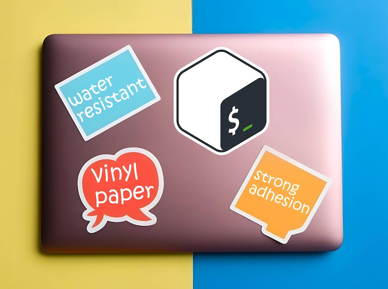 May include: A collection of stickers on a laptop. The stickers include text that reads "water resistant", "vinyl paper", and "strong adhesion". One sticker features a white cube with a black corner and a dollar sign.