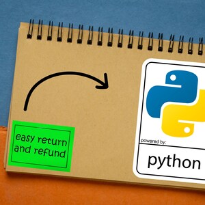May include: A spiral-bound notepad with a Python logo sticker, a green sticker with "easy return and refund" text, and a pen. The Python logo is blue and yellow. The background is blue and orange.