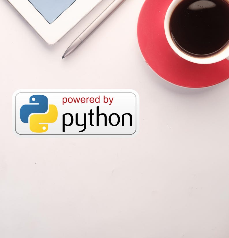 May include: Overhead shot of a white desk with a tablet, stylus, and a coffee cup on a red saucer. A sticker with the Python logo and the text "powered by python" is also visible.
