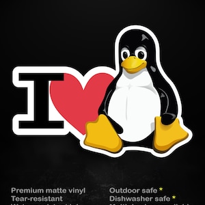 Op de afbeelding: Een sticker met een cartoon pinguïn ontwerp. De pinguïn heeft een witte buik, een zwart lichaam en gele voeten en snavel. Het ontwerp bevat een rood hart en de letter "I". De tekst "stick me! somewhere cool..." staat bovenaan.