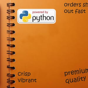May include: An orange spiral notebook with a black pen on the left side. A white sticker with the text "powered by python" is on the notebook. The notebook also has the words "Crisp Vibrant" and "premium quality".